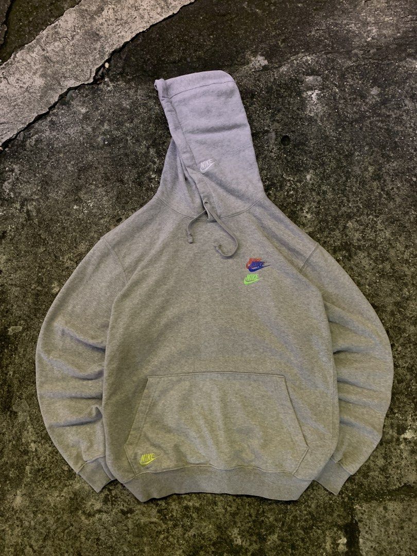 Nike Grey Hoodie with Multi-Color Logo (Category: Hoodies) located in Manila. Submitted by loyspalencia (Listing ID 1465263483, Image 1). Description: - Grey Nike hoodie - Multi-color embroidered Nike logo on chest - Small neon green Nike logo on left hem - Small embroidered Nike logo on hood - Kangaroo pocket - Drawstring hood - Dimes: W-25 / L-27 / Sleeves- 24 - Size: Meduim cut tags - Execellent Condition.