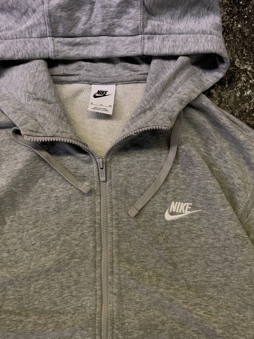 Nike Grey Zip-Up Hoodie (Category: Hoodies) located in Manila. Submitted by loyspalencia (Listing ID 1465263052, Image 2). Description: - Grey Nike zip-up hoodie - Classic Nike swoosh logo on chest - Full zip closure - Attached hood - Two convenient front pockets - Size: XL - Made in China - Dimes: W-25 / L- 28/ Sleeve- 23 - Size: Large - Execellent Condition.