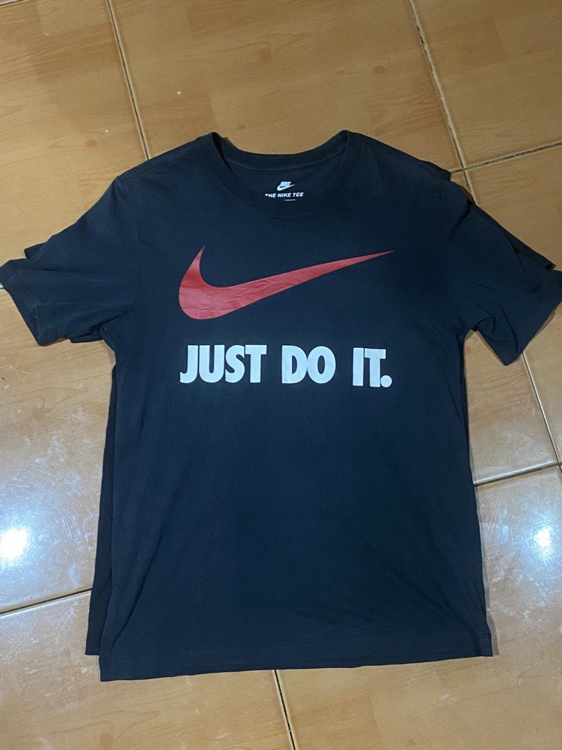 Nike Just Do It Black Tee Shirt (Category: Shirts) located in Cavite. Submitted by rennviyoh122928 (Listing ID 1465308659, Image 1). Description: - Brand: Nike - Color: Black with red swoosh and white 'Just Do It' text - Fit: Standard fit with classic crew neck and short sleeves - Material: Comfortable, breathable cotton - Condition: Clean and ready to wear - Versatile: Great for casual streetwear, daily wear, or workouts.