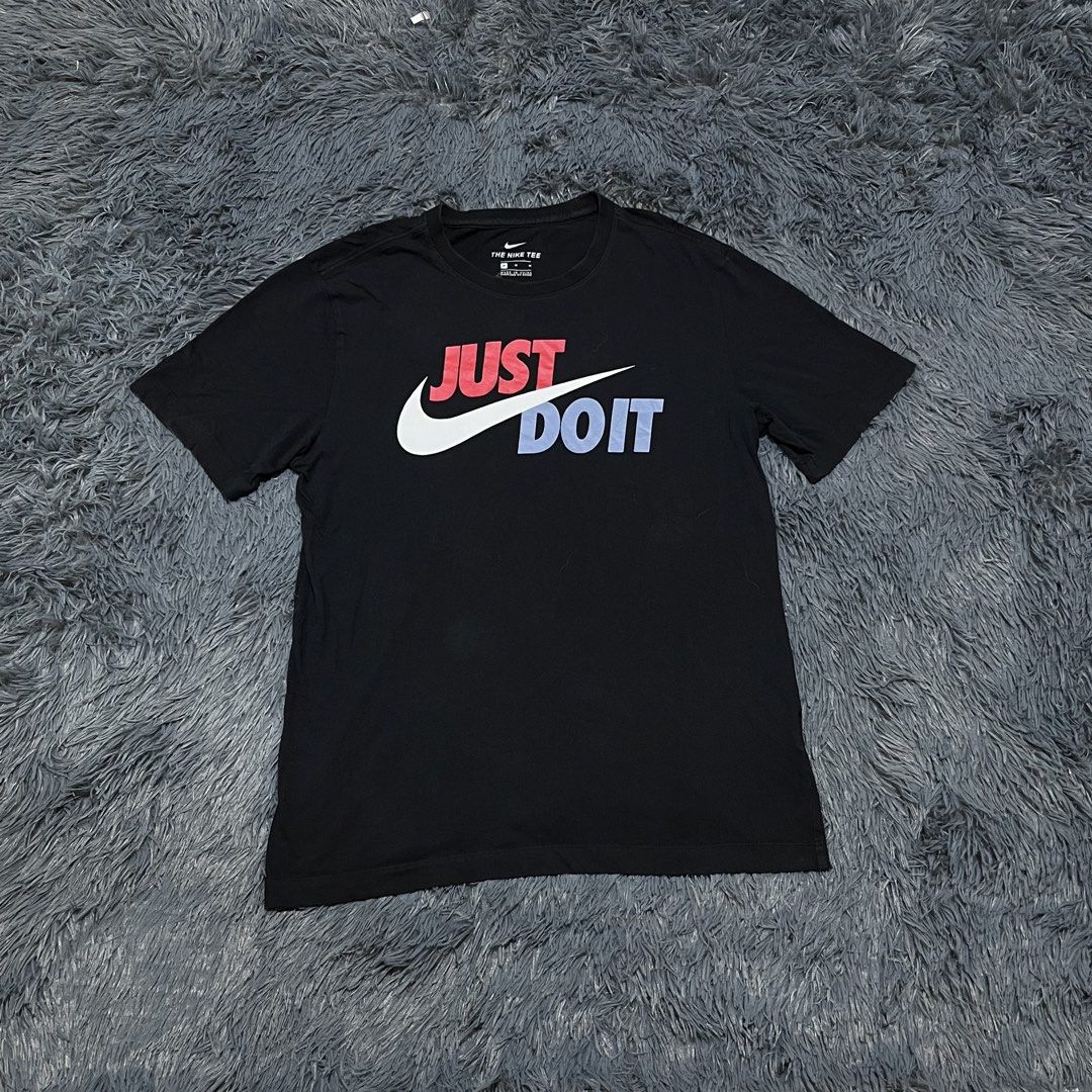 Nike Just Do It Black T-Shirt (Category: Tshirts & Polo Shirts ) located in Batangas. Submitted by jaylord_g (Listing ID 1465282549, Image 1). Description: - 20x26 - Medium-Large - Brand: Nike - Style: Classic Just Do It graphic tee - Color: Black with red, white, and blue print - Size: Medium - Material: 100% Cotton - Fit: Standard crew neck, short sleeves - Condition: Clean, excellent pre-loved condition with no major flaws on fabric or print.
