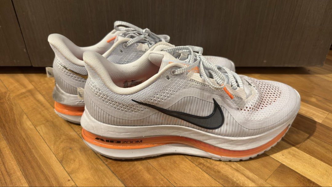 Nike Pegasus Premium (Category: Sneakers) located in Taguig. Submitted by s.tree (Listing ID 1465342443, Image 1). Description: - Model: Nike Pegasus Premium - Colorway: White and Orange - Condition: Uppers are mostly clean with minor scuffs near the back midsole; outsoles show dirt from previous use/runs -No more box.