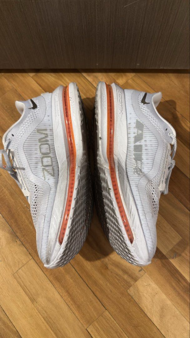 Nike Pegasus Premium (Category: Sneakers) located in Taguig. Submitted by s.tree (Listing ID 1465342443, Image 3). Description: - Model: Nike Pegasus Premium - Colorway: White and Orange - Condition: Uppers are mostly clean with minor scuffs near the back midsole; outsoles show dirt from previous use/runs -No more box.