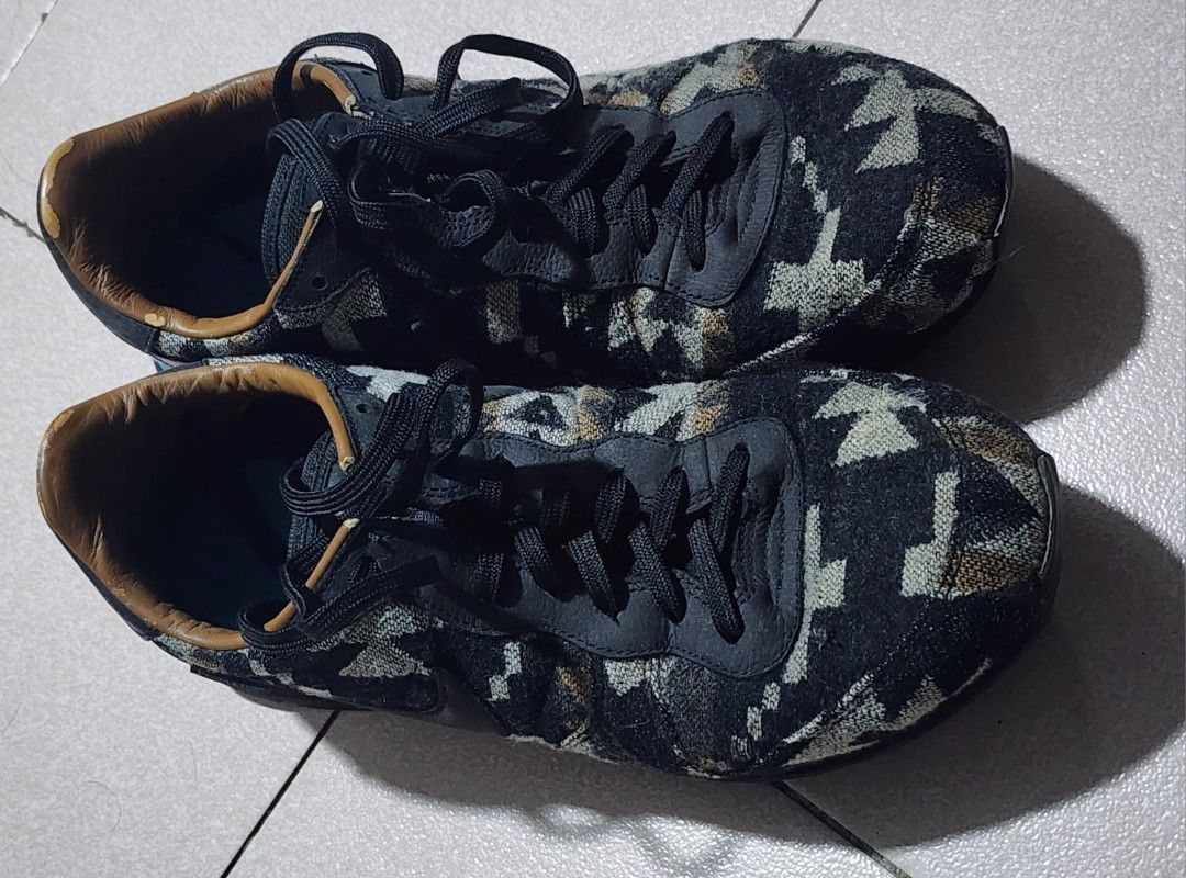Nike Pendleton Internationalist Black Wool Geometric Sneakers (Category: Sneakers) located in Manila. Submitted by chichayako (Listing ID 1465214259, Image 3). Description: - Brand: Nike Internationalist - Material: Pendleton wool in black/grey geometric pattern with leather swoosh - Accents: Small Pendleton tag near the collar and blue midsole stripe - Interior: Brown leather lining (minor peeling visible at the back edges) - Sole: Durable waffl