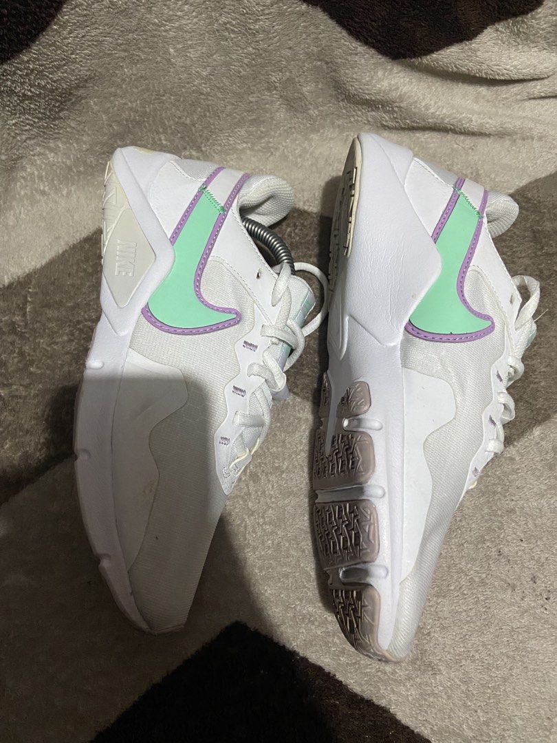 Nike sneakers white mint purple size US 6 (Category: Sneakers) located in Manila. Submitted by kiyanna.preloved (Listing ID 1465362031, Image 1). Description: - Brand: Nike - Model: CQ9545-100 - Color: White with mint green and purple swoosh accents - Size: US 6 / UK 3.5 / EUR 36.5 - Condition: Clean white uppers, light wear on the tread underneath - Details: Original size tag intact inside the tongue - Style: Great everyday casual trainers.