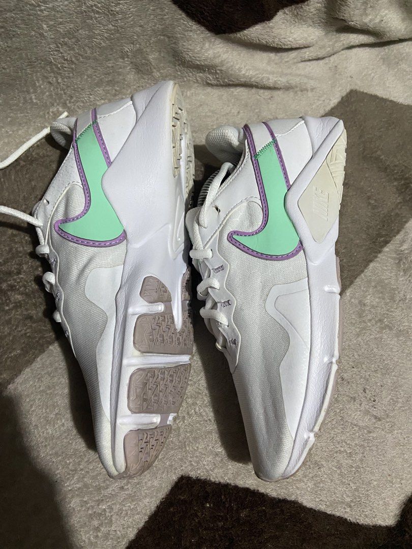 Nike sneakers white mint purple size US 6 (Category: Sneakers) located in Manila. Submitted by kiyanna.preloved (Listing ID 1465362031, Image 3). Description: - Brand: Nike - Model: CQ9545-100 - Color: White with mint green and purple swoosh accents - Size: US 6 / UK 3.5 / EUR 36.5 - Condition: Clean white uppers, light wear on the tread underneath - Details: Original size tag intact inside the tongue - Style: Great everyday casual trainers.