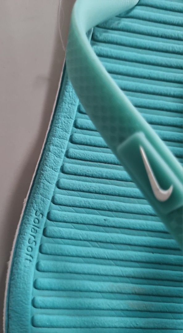 Nike Solarsoft Thong Flip Flops Turquoise Blue Size W7 (Category: Slippers and slides) located in Danao, Cebu. Submitted by CaxeCart (Listing ID 1465224843, Image 2). Description: - Brand: Nike - Style: Solarsoft thong sandals - Size: Women's US 7 / EUR 38 - Color: Teal with white accents and Nike swoosh logo - Features: Comfortable textured footbed, durable white outer sole - Origin: Made in Vietnam - Condition: Overall clean condition, minor di