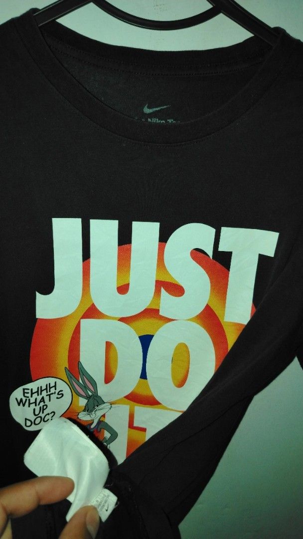 Nike Space Jam Bugs Bunny Just Do It T-Shirt (Category: Tshirts & Polo Shirts ) located in Cavite. Submitted by ukaynglahat (Listing ID 1465284143, Image 3). Description: - Brand: Nike - Design: Space Jam crossover with Bugs Bunny, target logo, and 'Ehhh What's Up Doc?' quote - Color: Black with white graphic text - Size: S (Standard fit) - Material: 100% cotton - Condition: Regular wear with minimal fading - Style: Crew neck, short sleeves.