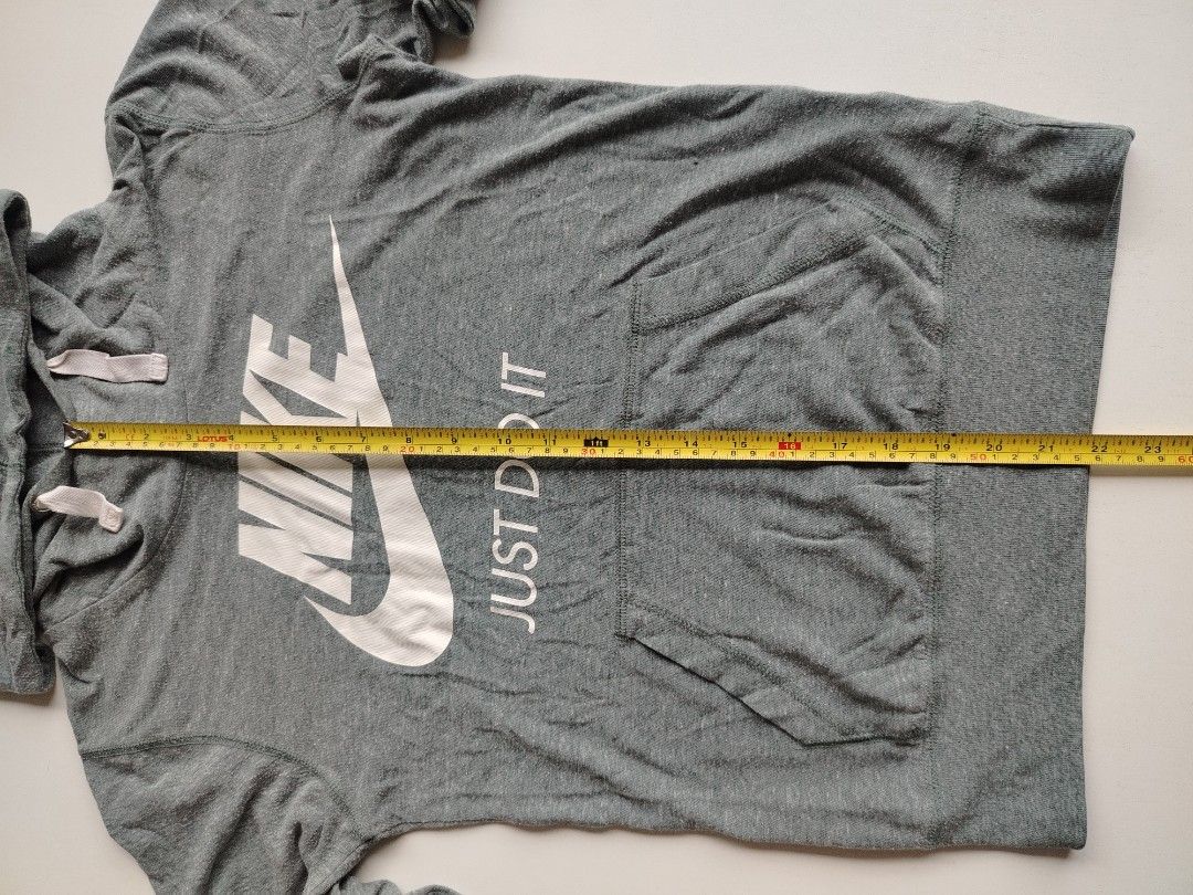 Nike swoosh jacket (Category: Coats, Jackets and Outerwear) located in Manila. Submitted by rockandrolly (Listing ID 1465378271, Image 2). Description: 🏃 NIKE Lightweight Hoodie — S Classic Everyday Comfort ✅ Brand: Nike — 100% authentic ✅ Color: Heather gray — versatile & easy to match ✅ Size: Small — chest 21" / length 26" ✅ Fabric: Soft lightweight jersey — perfect for AC, travel, or mild weather ✅ Details: ✔️ Iconic Swoosh + "Just Do It" gra