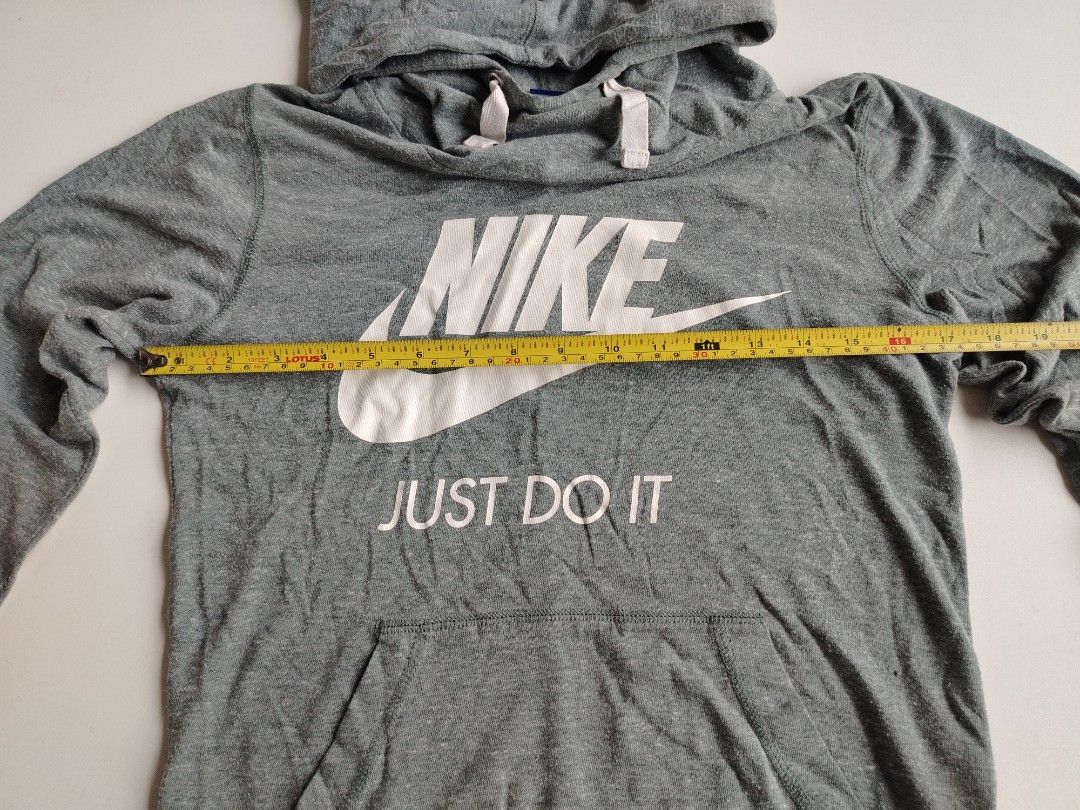 Nike swoosh jacket (Category: Coats, Jackets and Outerwear) located in Manila. Submitted by rockandrolly (Listing ID 1465378271, Image 3). Description: 🏃 NIKE Lightweight Hoodie — S Classic Everyday Comfort ✅ Brand: Nike — 100% authentic ✅ Color: Heather gray — versatile & easy to match ✅ Size: Small — chest 21" / length 26" ✅ Fabric: Soft lightweight jersey — perfect for AC, travel, or mild weather ✅ Details: ✔️ Iconic Swoosh + "Just Do It" gra