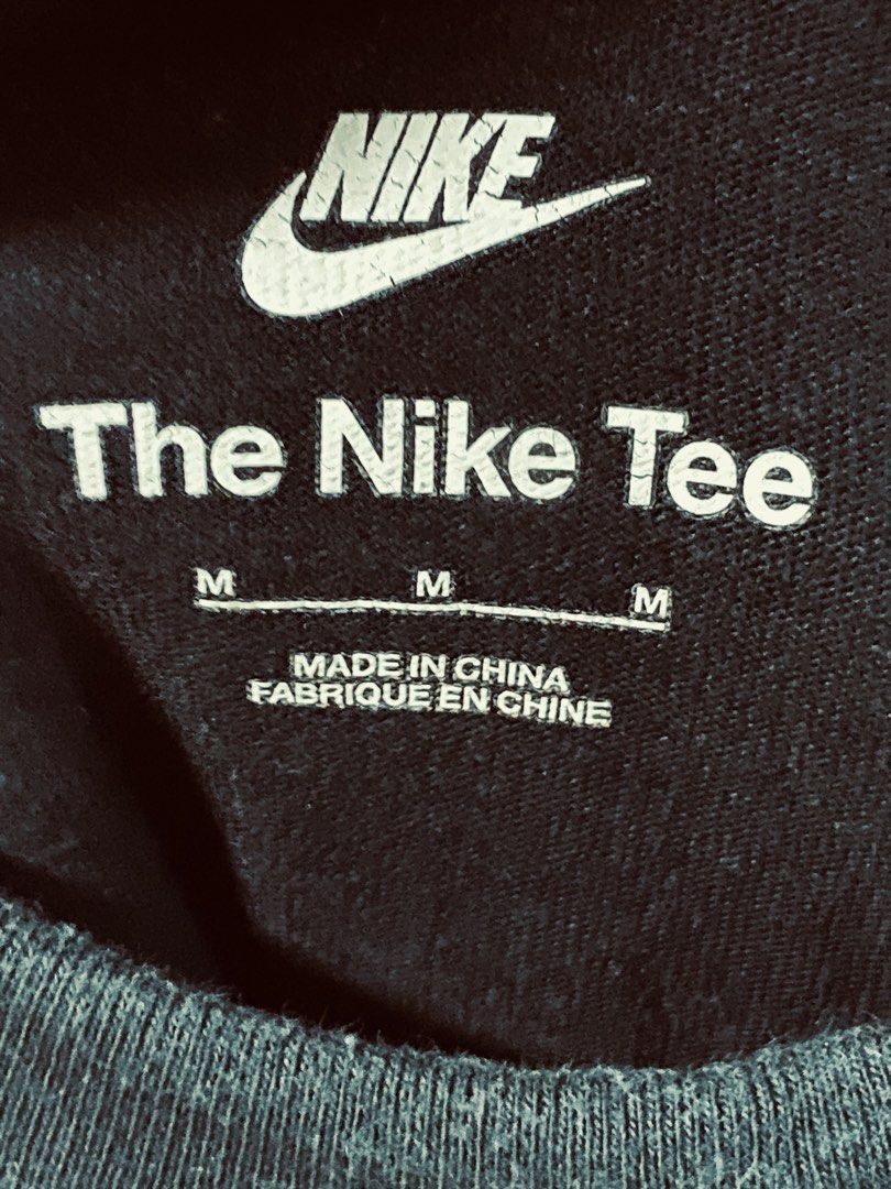 Nike The Nike Tee Pocket T-Shirt Black Medium (Category: Tshirts & Polo Shirts ) located in Navotas City. Submitted by bayxsell (Listing ID 1465337613, Image 2). Description: - Brand: Nike - Color: Black - Size: Medium (M) - Material: 100% Cotton - Design: Classic crew neck, short sleeves - Features: Front chest pocket with layered Nike logo graphics - Details: Extra Nike Sportswear woven tags at the lower side hem - Condition: Excellent / Good a