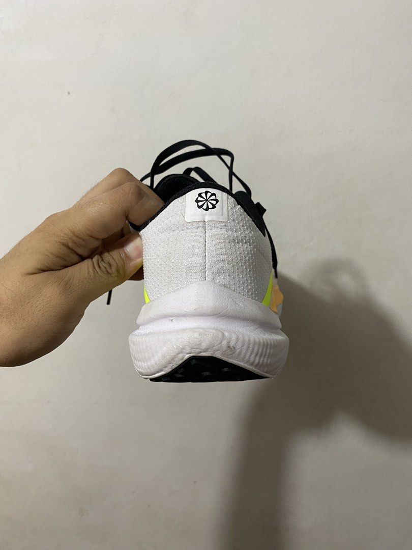 Nike Winflo 10 running shoes (Category: Dress Shoes) located in Manila. Submitted by davidjorna63894 (Listing ID 1465337602, Image 2). Description: COLOR: White with neon yellow and orange accents VERSATILE: Great for running or everyday wear CONDITIONS: Shows some signs of use on soles and uppers. Preloved pair, great cushioning ideal for daily running 📍Valenzuela City.