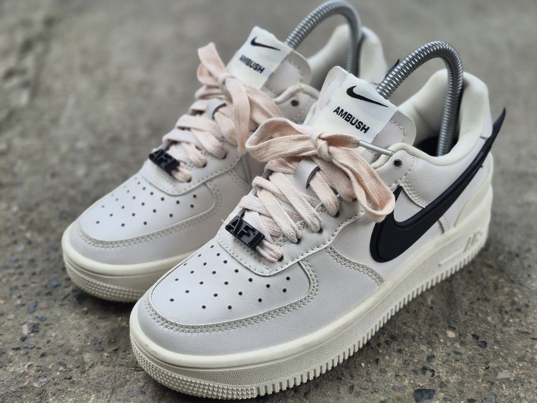 Nike x Ambush Air Force 1 Low Phantom Black (Category: Sneakers) located in Manila. Submitted by kushoenero (Listing ID 1465301800, Image 3). Description: - Brand: Nike x Ambush - Model: Air Force 1 Low - Colorway: Phantom White with exaggerated black rubber swooshes - Soles: Cream-colored sole unit with embossed Ambush heel counter branding - Laces & Details: Pinkish-beige laces, black AF1 dubraes, and dual-branded tongue tags - Condition: Clean