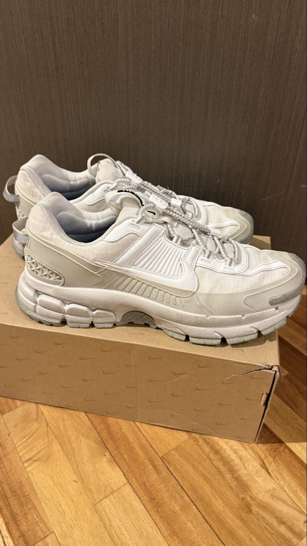 Nike Zoom Vomero Roam (Category: Sneakers) located in Taguig. Submitted by s.tree (Listing ID 1465341455, Image 1). Description: - Model: Nike Zoom Vomero Roam (White) - Original box included - Condition: Uppers have minor creasing and dirt from regular wear; inserts show normal wear.