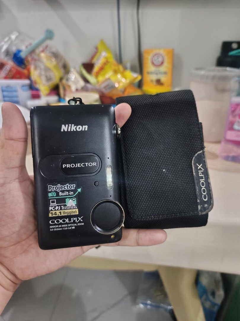 Nikon Coolpix S1200pj Built-in Projector (Category: Cameras) located in Manila. Submitted by jenmelvin001795 (Listing ID 1465324990, Image 1). Description: 👉 issue minor chip paint d nmn halata ✅14megapixel ✅projector ✅zoom in/ out ✅flash ✅all button working inclusion ✅original pouch ✅battery ✅strap ✅sd card .