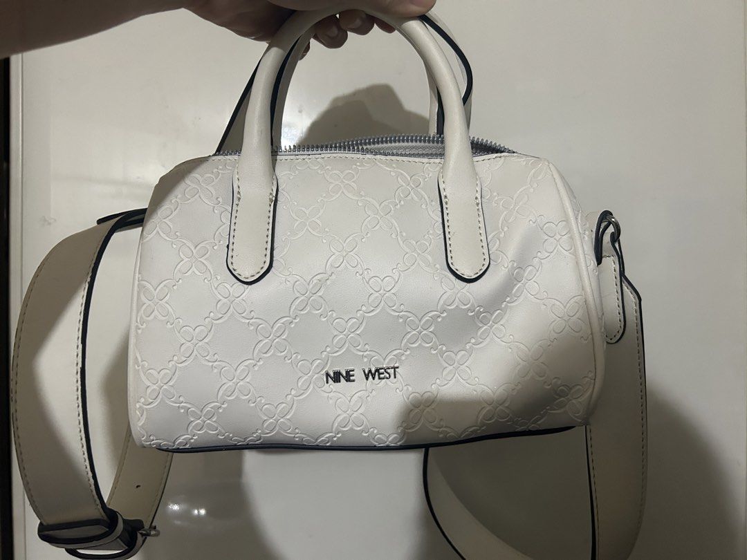Nine West White Mini Handbag with Satchel (Category: Shoulder Bags) located in Paranaque City. Submitted by inkling19 (Listing ID 1465296986, Image 1). Description: - Brand: Nine West - Color: White - there is like streak/dirt on the strap but can be possibly be cleaned Original price was 3200.