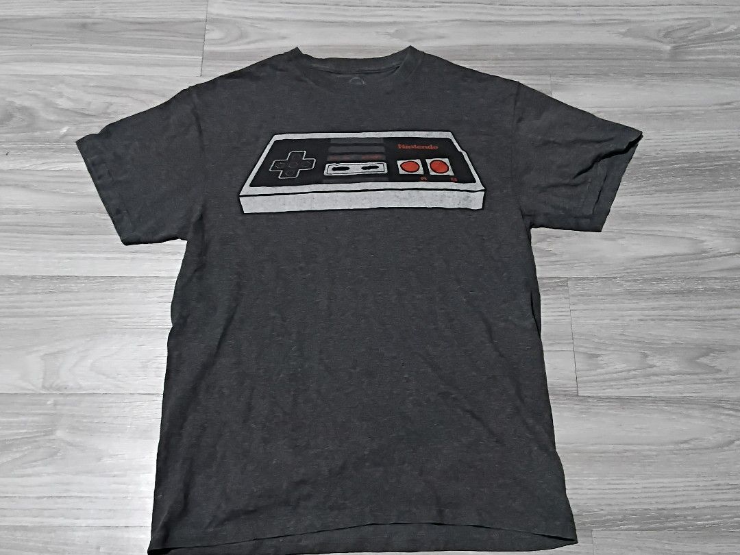 NINTENDO NES CONTROLER (Category: Tshirts & Polo Shirts ) located in Calasiao. Submitted by thriftkartel26 (Listing ID 1465254156, Image 1). Description: with small pinhole.