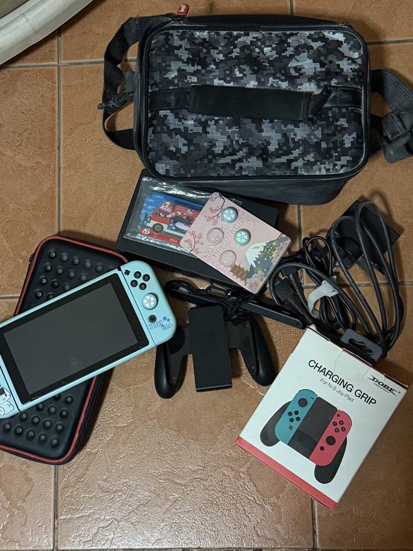 nintendo switch 1 V2 (Category: Nintendo) located in Quezon City. Submitted by viago (Listing ID 1465054885, Image 1). Description: NINTENDO SWITCH 1 V2 WITH GAME CONSOLE, CHARGER WITH MEMORY CARD CHARGING GRIP COVER AND TEMPERED CARD GAME BAG AMIIBO CARDS .