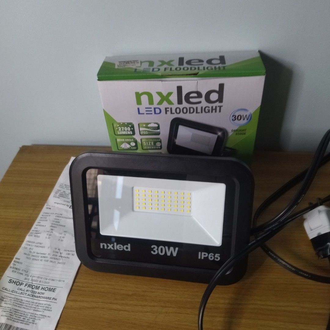 Nxled LED Floodlight 30W IP65 Daylight 6500K (Category: Lighting) located in Quezon City. Submitted by starapplenaynten (Listing ID 1465273750, Image 1). Description: Nxled 30W LED Floodlight (2,700 Lumens) Converted to Plug-In with Cord & Fresh Warranty. Newly bought last September 30, 2026(check the receipt) I am offering a brand-new Nxled 30W LED outdoor floodlight (Model: ANXFL-D30DL) that delivers a potent 2,700 lumens of crisp daylight illu