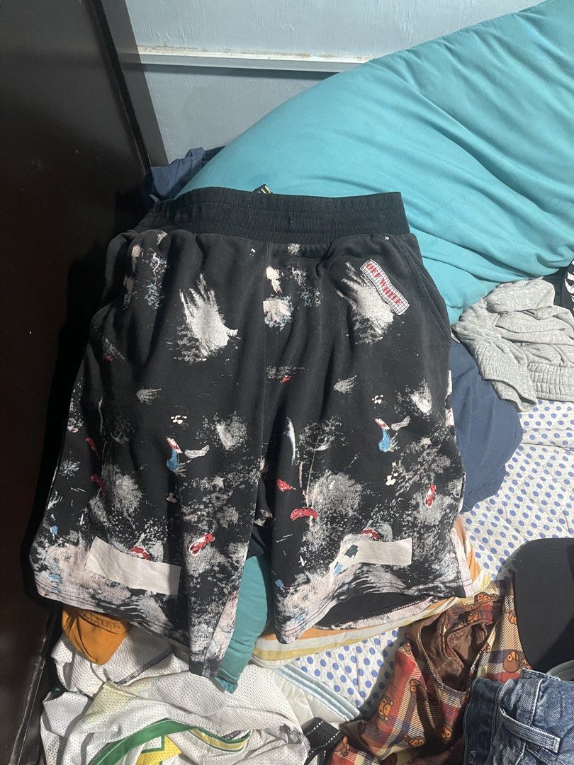 Off-White Galaxy Brush Overspray Shorts (Category: Shorts) located in Marikina City. Submitted by yvosss (Listing ID 1465293191, Image 1). Description: - Authentic Off-White black shorts - Features iconic galaxy paint splatter and brush stroke print - 'Seeing Things' blue text detail across the back waistband - Signature diagonal arrow graphics near the bottom hems - Comfortable relaxed fit with an elastic waistband - Bold streetwear staple with 