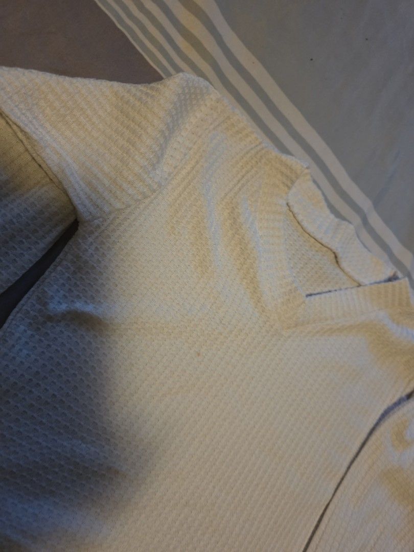 Off-white Waffle Knit V-Neck Long Sleeve Sweater (Category: Longsleeves) located in Manila. Submitted by cher0918 (Listing ID 1465262324, Image 2). Description: - Color: Off-white - Material: Soft textured thermal waffle knit fabric - Design: V-neckline and long sleeves - Details: Ribbed collar and cuffs with a standard fit - Versatility: Easy to layer or wear on its own, matches any outfit.