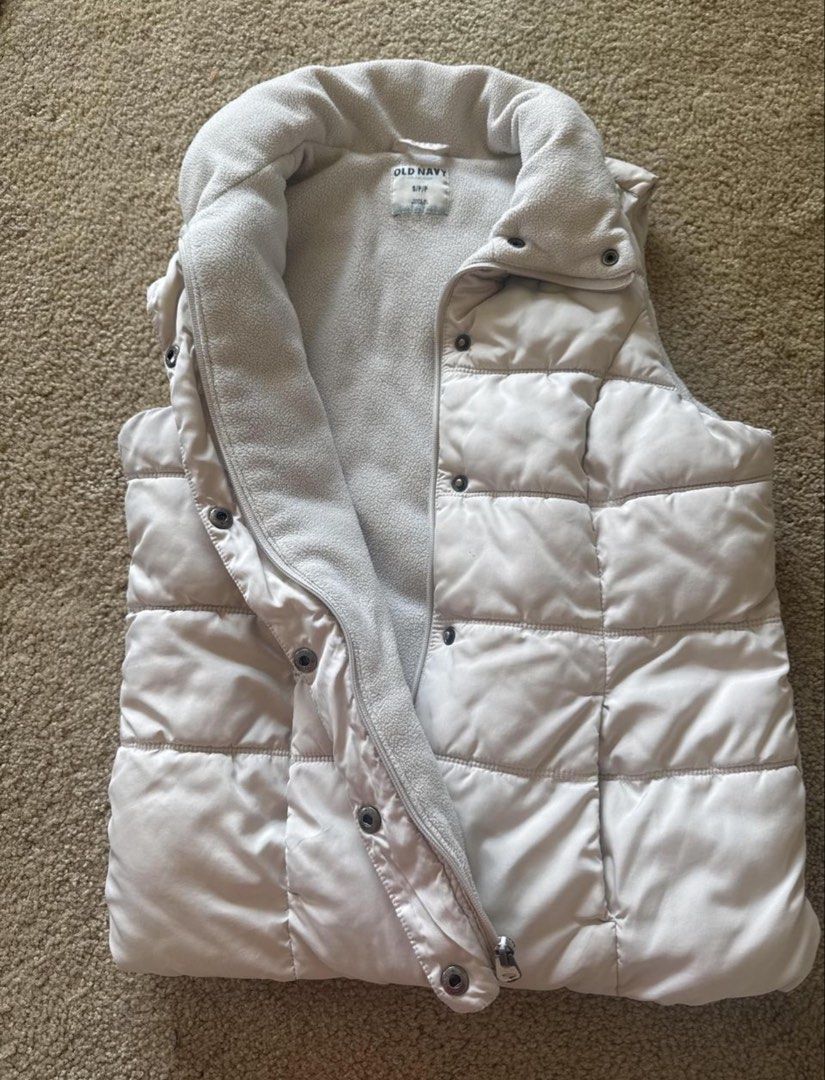 Old Navy Puffer Vest Beige Size S (Category: Coats, Jackets and Outerwear) located in Manila. Submitted by kaia_studios (Listing ID 1465373697, Image 1). Description: Old Navy light beige puffer vest in size small. Features a cozy fleece-lined interior, zip and snap closure, and a stylish quilted design. Perfect for layering in cooler weather! PM for details..