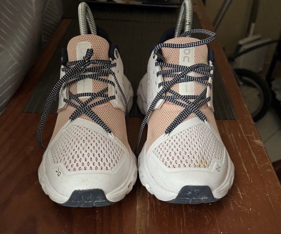 On Cloud Sneaker White Pink Navy (Category: Sneakers) located in Caloocan City. Submitted by ylieramae201821 (Listing ID 1465283459, Image 3). Description: - Brand: On Cloud Running Shoes - Colorway: White upper with peach pink mesh and navy blue collar lining - Features: Swiss engineering tag, CloudTec sole with black traction pads, and black/white dotted laces with metal eyelets - Condition: Moderate wear on bottom treads and a tiny mark on the