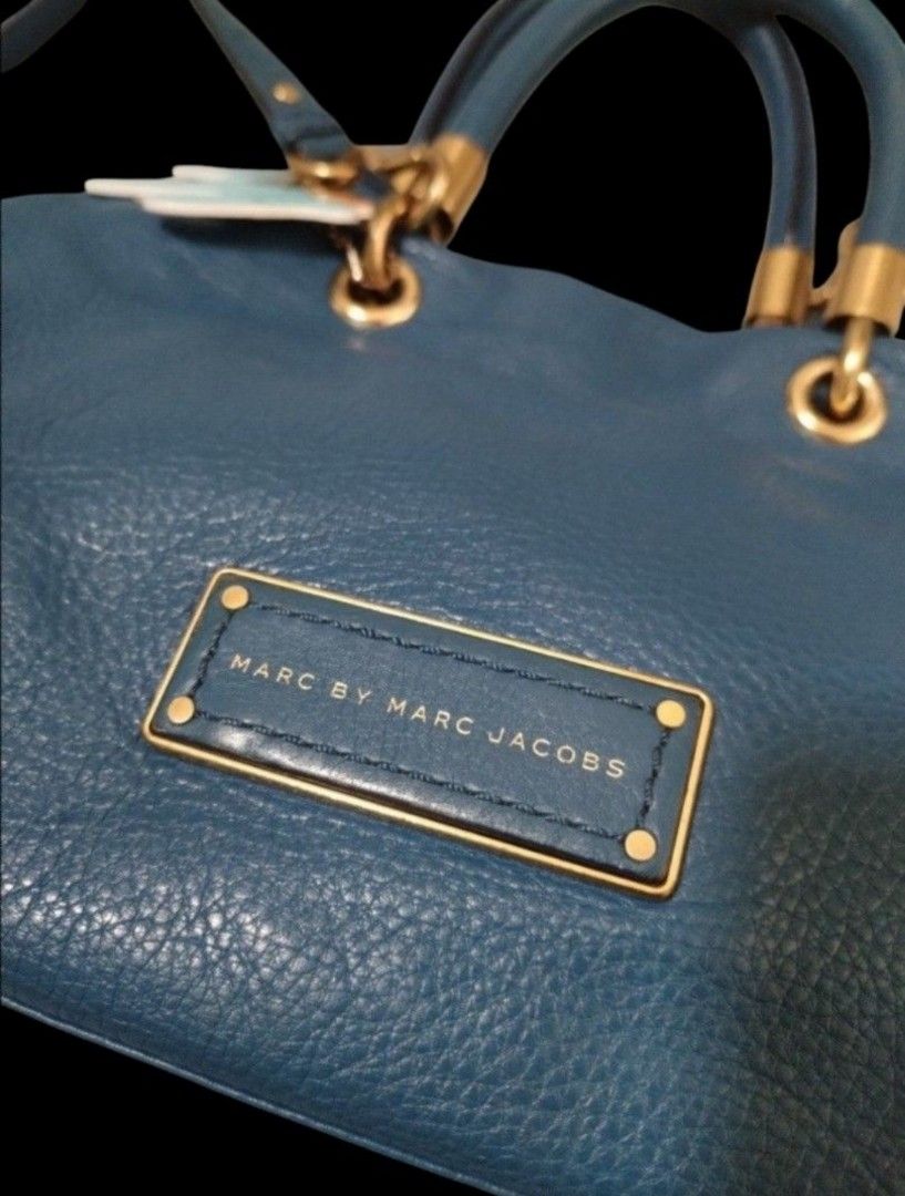 Original Marc by Marc Jacobs Satchel bag (Category: Luxury Bags & Wallets) located in San Juan City. Submitted by exclusivelyours (Listing ID 1465278125, Image 3). Description: Marc by Marc Jacobs "Classic Q" line (a hugely popular line from the late 2000s to mid-2010s era before the Marc by Marc Jacobs diffusion line was discontinued). ▪️ ​Material: Supple, heavy-grained pebbled cowhide leather. ▪️ ​Hardware: Antiqued brass/gold-tone hardware, f
