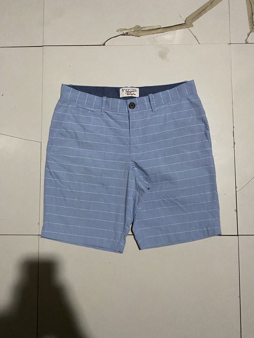 Original Penguin Striped Blue Shorts (Category: Shorts) located in Antipolo. Submitted by cogiestamaria (Listing ID 1465301031, Image 2). Description: - Brand: Original Penguin - Color: Light blue with stripes - Size: US 32 / EU 48 - Length 19.5 - Leg Opening 10.5 - No issue - color rate 10-10 - good as new - Features: Button closure, zip fly, front and back pockets - Condition: Clean, excellent pre-loved condition - Extras: Includes extra spare 