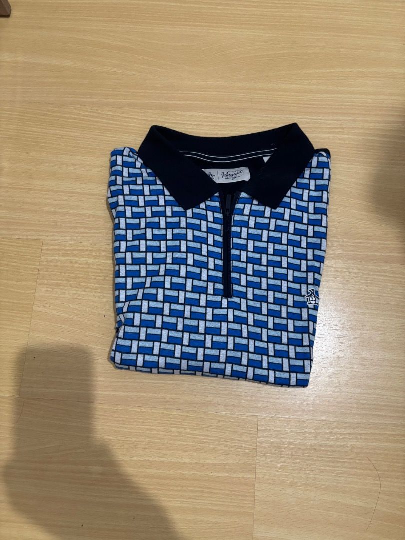 Original Penquin ZipUp Polo (Category: Formal Shirts) located in Caloocan City. Submitted by joaquinjoseph (Listing ID 1465218591, Image 1). Description: Original Penguin ZipUp Polo 🔵⚪ • Size: Large (L) • Good condition • Unique blue/white geometric pattern • Original Penguin • ₱600 • Rush sale • MOP: GCash / Cash • Meet-up or shipping available (Paranaque Location).