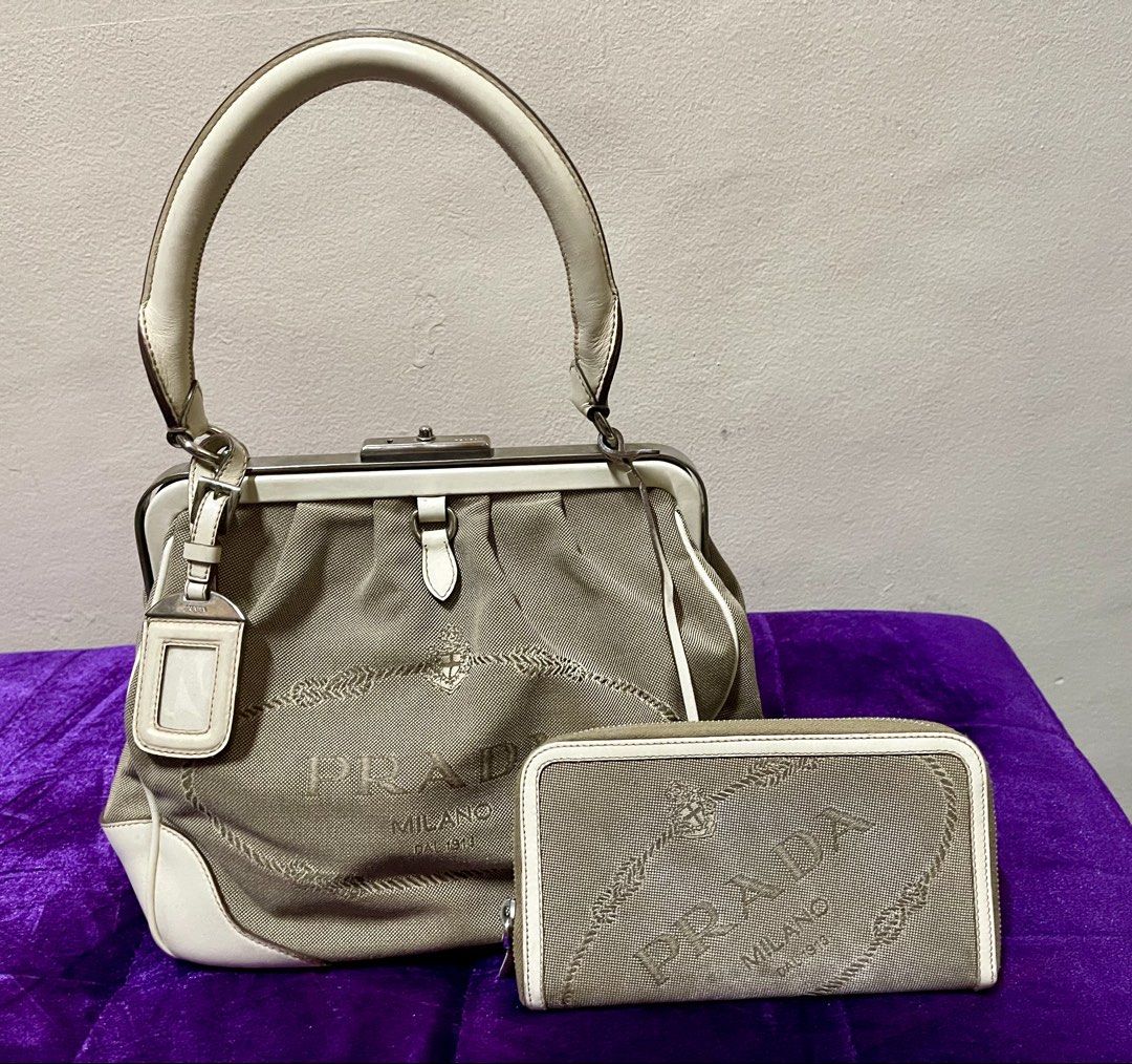 Authentic Prada Canapa Logo Frame handbag and Prada wallet (Category: Wallets & Card holders) located in Muntinlupa City. Submitted by _s0phia (Listing ID 1465246381, Image 1). Description: Preloved authentic Prada Canapa Logo Frame handbag and Prada wallet.