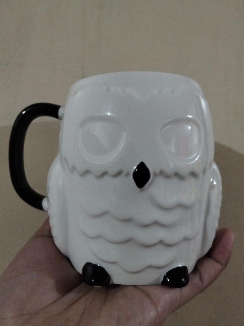 Owl Ceramic Mug White and Black (Category: Coffee & Tea Tableware) located in Caloocan City. Submitted by agr_shop (Listing ID 1465283197, Image 1). Description: - Adorable white ceramic owl mug with textured feather details - Chic black handle, beak, and feet at the base - Smooth glazed finish all over for a polished look - Generous size ideal for a solid morning coffee or tea - Fun and quirky addition to your mug collection or desk setup.