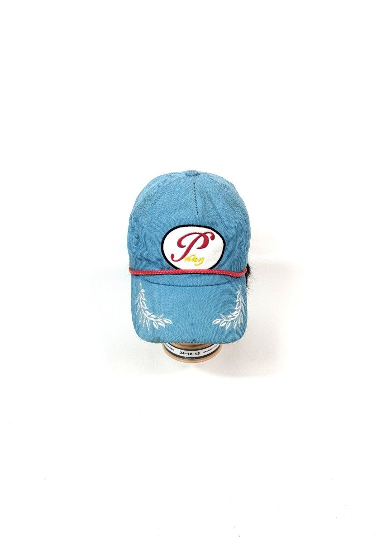 Peaceminusone Corduroy Cap Blue (Category: Caps & Hats) located in Manila. Submitted by callmetin (Listing ID 1465172588, Image 1). Description: - Brand: Peaceminusone - Material: Bright blue corduroy - Details: White oval logo patch with red/yellow embroidery, red braided rope across the brim - Accents: White embroidered leaf graphics on the side panels and signature daisy embroidery on the back - Fit: Adjustable leather strap closure with metal