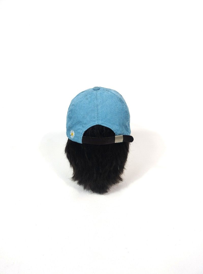 Peaceminusone Corduroy Cap Blue (Category: Caps & Hats) located in Manila. Submitted by callmetin (Listing ID 1465172588, Image 3). Description: - Brand: Peaceminusone - Material: Bright blue corduroy - Details: White oval logo patch with red/yellow embroidery, red braided rope across the brim - Accents: White embroidered leaf graphics on the side panels and signature daisy embroidery on the back - Fit: Adjustable leather strap closure with metal