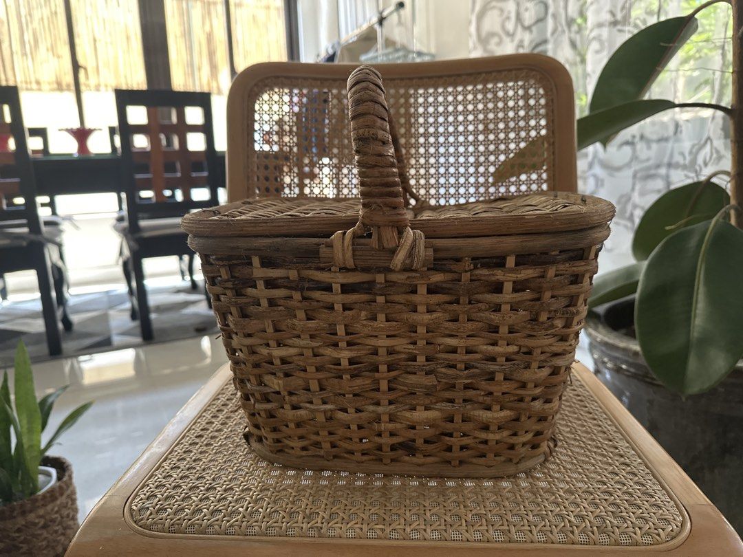 Picnic Basket with Double Lids (Category: Storage Boxes & Baskets) located in Manila. Submitted by decluttering.anj (Listing ID 1465180310, Image 1). Description: - Natural woven wicker with an earthy brown tone and rustic texture - Sturdy central handle and two separate hinged lids that open outwards - Perfect for outdoor picnics, romantic dates, home storage or as photoshoot props (Was used for photoshoot purposes only).