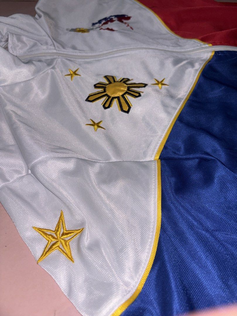 Pilipinas Philippines National Flag Track Jacket (Category: Coats, Jackets and Outerwear) located in Binan City. Submitted by fashion_claims (Listing ID 1465251847, Image 3). Description: - Philippine flag color blocking (white, blue, red) with yellow piping - Embroidered sun, stars, and map details on the chest - "PILIPINAS" text and star embroidered on the back - Full zip closure with a stylish stand-up collar - Great for national pride, cultur