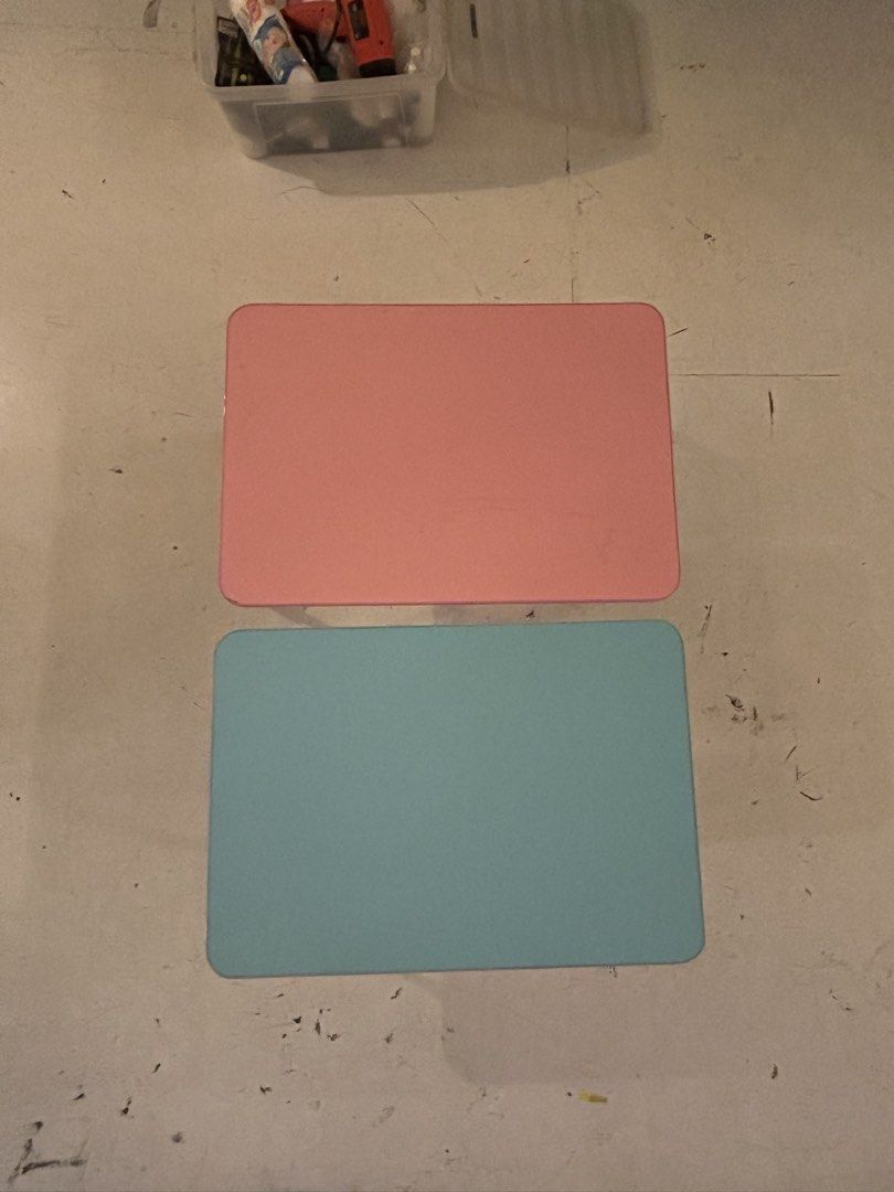 Pink and Blue Foldable Laptop Study Tables (Category: Tables & Sets) located in Quezon City. Submitted by ccr26 (Listing ID 1465306112, Image 3). Description: USED ONCE FOR SHOOT ONLY TAKE BOTH FOR 1200 - Set of 2 portable study desks (1 Pink, 1 Light Blue) - Features convenient foldable legs for easy storage - Sturdy metal frames with black protective corner grips - Compact size ideal for working on the bed or floor - Stackable design folds comp