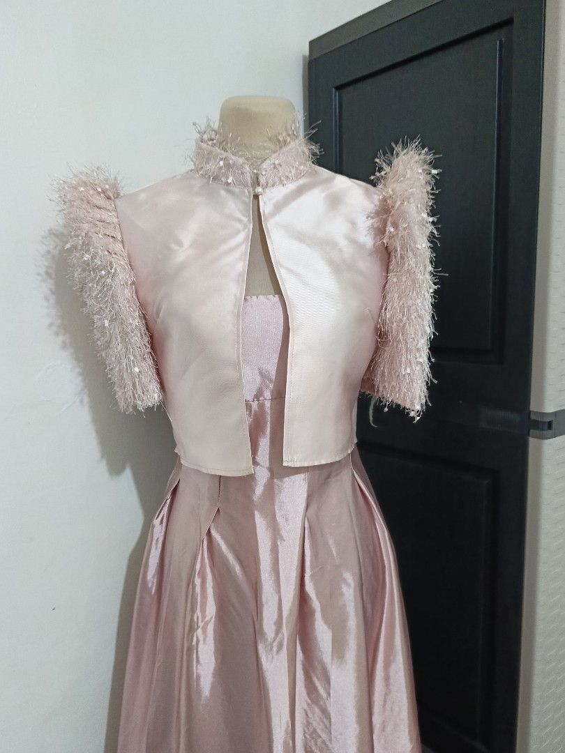 Pink Bolero (Category: Coats, Jackets and Outerwear) located in Cabanatuan. Submitted by lyxyx (Listing ID 1465306888, Image 1). Description: - Matching pink dress and cropped jacket set - High neckline with fuzzy trim and pearl button closure - Jacket features matching fuzzy textured short sleeves - Dress includes a structured bodice and pleated skirt - Smooth, shiny fabric finish - Perfect formal or event outfit.