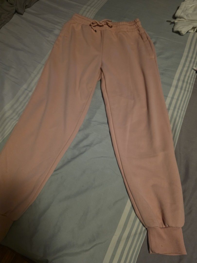 Pink fleece sweatpants with elastic cuffs (Category: Joggers) located in Manila. Submitted by cher0918 (Listing ID 1465276269, Image 2). Description: - Color: Pink - Style: High waist with adjustable drawstring - Features: Deep side pockets and ribbed elastic ankle cuffs - Interior: Soft fleece lining for extra warmth and comfort - Best for: Lounging at home or running errands.