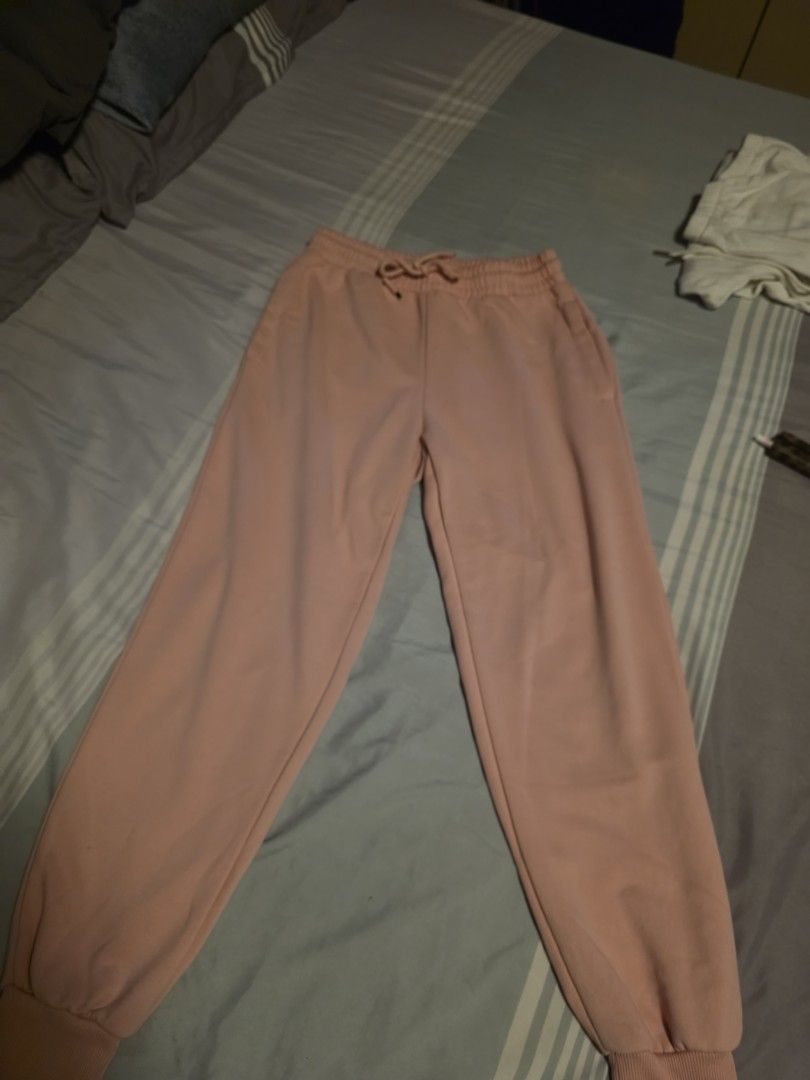 Pink fleece sweatpants with elastic cuffs (Category: Joggers) located in Manila. Submitted by cher0918 (Listing ID 1465276269, Image 1). Description: - Color: Pink - Style: High waist with adjustable drawstring - Features: Deep side pockets and ribbed elastic ankle cuffs - Interior: Soft fleece lining for extra warmth and comfort - Best for: Lounging at home or running errands.