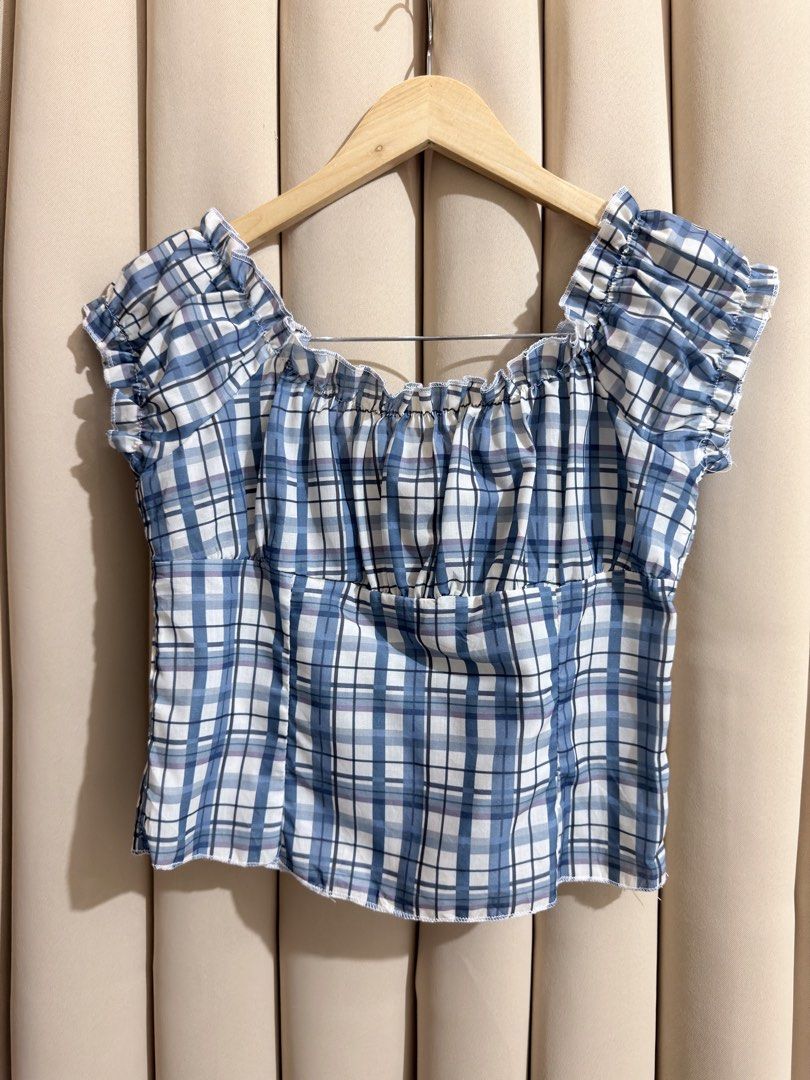 Plaid Milkmaid Croptop (Category: Blouses) located in Manila. Submitted by glamstylemnl (Listing ID 1465319798, Image 2). Description: ♡ SIZE: S ♡ BUST: 32 ♡ Swipe left to see the actual color & details ♡ Ruffled cap sleeves / front tie ♡ HQ • 10/10 ♡ Ready to wear 👚.
