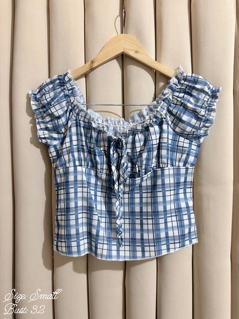 Plaid Milkmaid Croptop (Category: Blouses) located in Manila. Submitted by glamstylemnl (Listing ID 1465319798, Image 1). Description: ♡ SIZE: S ♡ BUST: 32 ♡ Swipe left to see the actual color & details ♡ Ruffled cap sleeves / front tie ♡ HQ • 10/10 ♡ Ready to wear 👚.