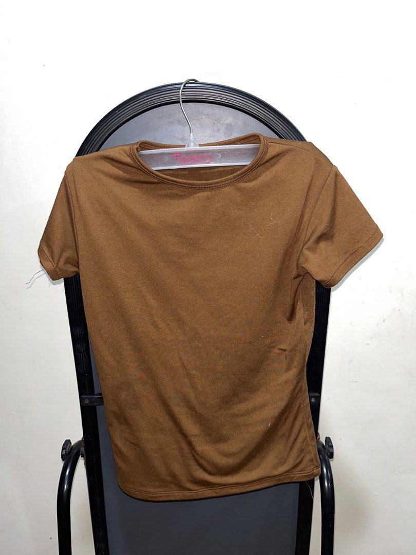 Plain Brown Short Sleeve T-shirt (Category: Shirts) located in Rizal. Submitted by bypc5678 (Listing ID 1465354846, Image 1). Description: - Color: Brown - Fitted cut XS - Neckline: Crew neck - Style: Basic everyday top - Pairing: Easy to match with jeans or skirts.