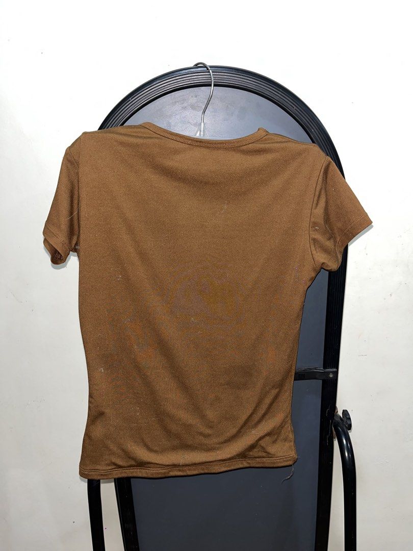 Plain Brown Short Sleeve T-shirt (Category: Shirts) located in Rizal. Submitted by bypc5678 (Listing ID 1465354846, Image 2). Description: - Color: Brown - Fitted cut XS - Neckline: Crew neck - Style: Basic everyday top - Pairing: Easy to match with jeans or skirts.