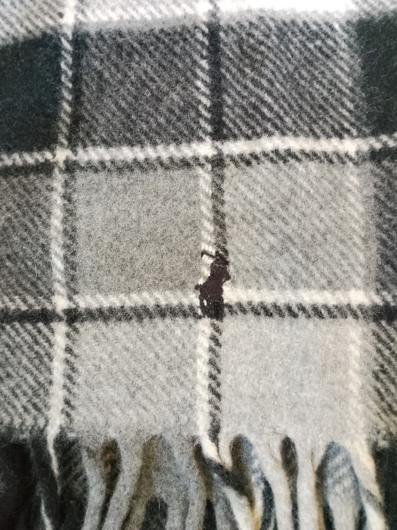 Polo Ralph Lauren Checkered Wool Scarf (Category: Scarves) located in Bogo. Submitted by algarme2018 (Listing ID 1465266478, Image 3). Description: - Brand: Polo Ralph Lauren - Design: Classic black, grey, and white plaid - Material: 100% Wool, Made in Italy - Details: Signature embroidered pony logo and fringe at both ends - Condition: Clean tag attached, soft winter essential.