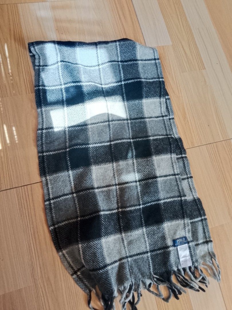 Polo Ralph Lauren Checkered Wool Scarf (Category: Scarves) located in Bogo. Submitted by algarme2018 (Listing ID 1465266478, Image 1). Description: - Brand: Polo Ralph Lauren - Design: Classic black, grey, and white plaid - Material: 100% Wool, Made in Italy - Details: Signature embroidered pony logo and fringe at both ends - Condition: Clean tag attached, soft winter essential.