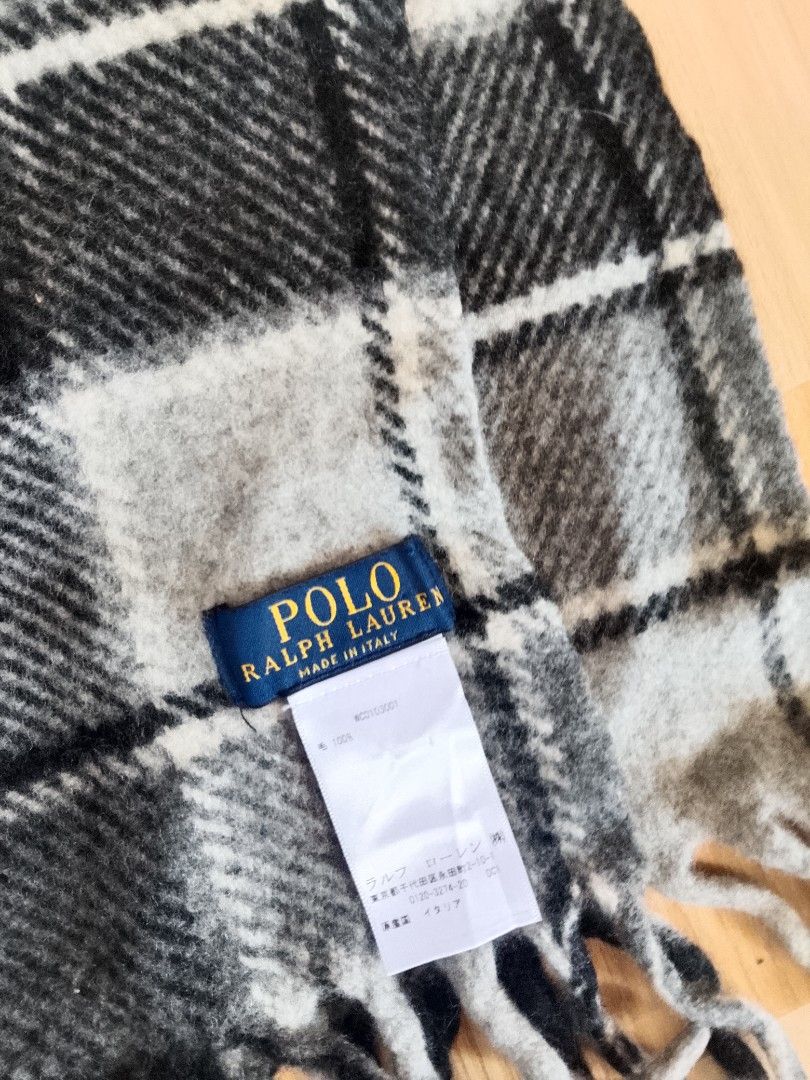 Polo Ralph Lauren Checkered Wool Scarf (Category: Scarves) located in Bogo. Submitted by algarme2018 (Listing ID 1465266478, Image 2). Description: - Brand: Polo Ralph Lauren - Design: Classic black, grey, and white plaid - Material: 100% Wool, Made in Italy - Details: Signature embroidered pony logo and fringe at both ends - Condition: Clean tag attached, soft winter essential.