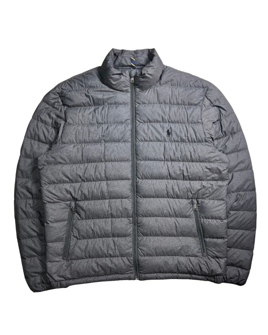 Polo Ralph Lauren Grey Lightweight Bleeker Packable Down Jacket (Category: Coats, Jackets and Outerwear) located in Baguio. Submitted by marcusmartin2600 (Listing ID 1465186731, Image 2). Description: Size: Large on tag Condition: Excellent 📏 Measurement via Tape Measure (in inches): Width: 24.5” Length: 26” Shoulders: 20.5” Sleeve Length: 26.5” Hem: 21” . Note: Please check detailed photos before bidding to avoid cancellations. Also available a