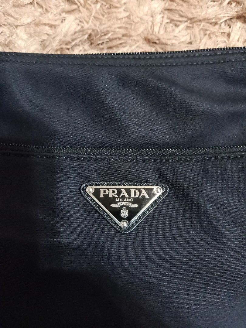 Prada cross body bag black (Category: Cross-body Bags) located in Binmaley. Submitted by fashionluxury058 (Listing ID 1465274844, Image 3). Description: prada cross body bag black almost new... size: medium color black unisex.