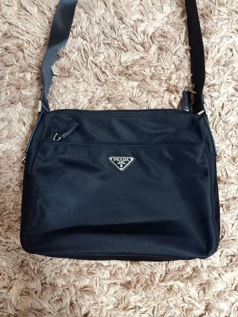 Prada cross body bag black (Category: Cross-body Bags) located in Binmaley. Submitted by fashionluxury058 (Listing ID 1465274844, Image 2). Description: prada cross body bag black almost new... size: medium color black unisex.