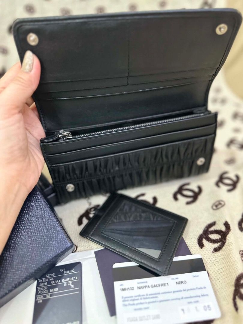 Prada Nappa Gaufre 1 Black Leather Long Wallet (Category: Luxury Bags & Wallets) located in San Pedro. Submitted by silverlion-4d46 (Listing ID 1465213875, Image 2). Description: - Authentic Prada long wallet in luxurious black nappa gaufre leather - Features a soft pleated texture, silver-tone hardware, and iconic front logo lettering - Includes a matching cardholder with a convenient clear ID window - Spacious interior equipped with card slots,